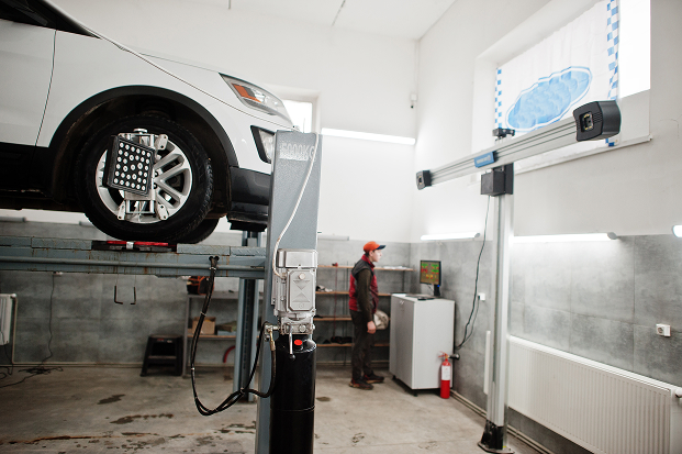 american-suv-car-on-stand-for-wheels-alignment-cam-2025-02-11-02-14-03-utc